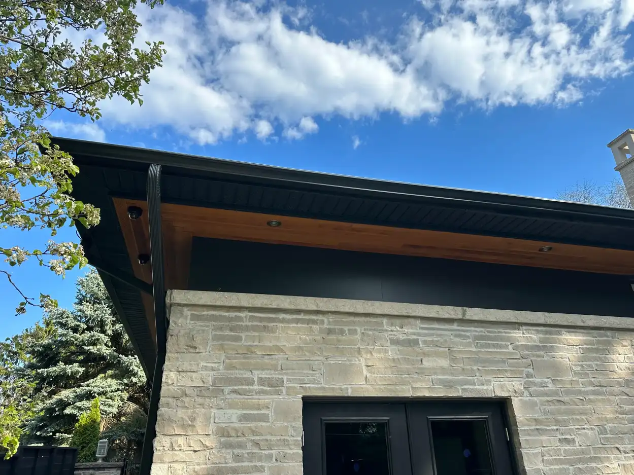 Emergency eavestrough repair in Toronto during winter storm conditions